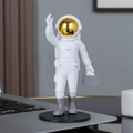 Astronaut figurine with golden visor and grey briefcase on black circular base - No.12 Gold Model B