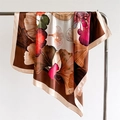 Silk-satin square scarf with ginkgo leaf print in brown and red hanging on a hanger - 90x90cm / Coffee