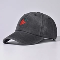 Detail view of a washed cotton baseball cap featuring a vibrant strawberry embroidery - Adjustable / Black Strawberry