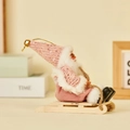 Plush Christmas gnome with pink sequin hat sitting on a wooden sleigh holiday decoration - Sled Style (Pink Sequin)