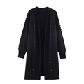 Detail shot of black knitted cardigan featuring silver stud accents on the sleeves - S / Black