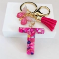 Detail of pink resin letter T keychain with golden butterfly and soft tassel - Rose Red Butterfly Tassel Clip / Letter T