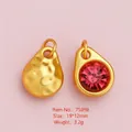 Golden alloy teardrop charms with hammered texture and a bright red crystal inlay - Gold Teardrop Red Rhinestone Pendant
