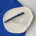 Detailed view of rectangular blue acetate hair clip with France Handmade gold lettering - Rectangular Clip / Navy Blue