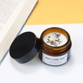 Lavender soy wax candle in amber glass jar with black lid and dried floral petals - Lavender Granules