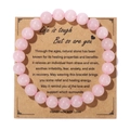 Handmade pink natural stone beaded bracelet on a brown kraft card with healing message - Rose Quartz