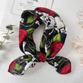 Gothic style black square scarf with red rose and skull prints tied in a bow - Halloween Skull Rose