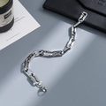 Polished stainless steel curb chain bracelet with lobster clasp on luxury lifestyle props - gf141-Rectangular Oval Mix