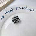 Mini acetate hair claw clip featuring classic black and white checkered pattern - Small Black and White Checkered