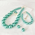 Green pearl jewelry set with necklace bracelet ring and earrings on white background - Aqua Blue