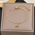 Elegante bracciale in acciaio al titanio dorato con ciondoli a sfera su portagioie - 518 Oro Doppia Sfera (518 Oro)