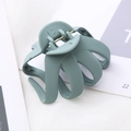 Macro detail of 8cm matte green octopus hair claw clip with durable metal spring - Light Gray