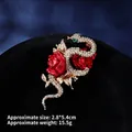 Detail view of a vintage snake and red rose brooch with crystals, size 2.8x5.4cm - Snake with Rose (XZ24216)
