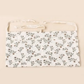 Detail of soft cotton muslin texture and vintage floral botanical print on the waist apron - Printing