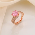 Macro detail of rose gold open ring with large pink zircon and side stones on fabric - Rose Gold Plated Pink Zirconia