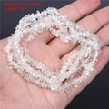 Hand holding 3-5mm natural clear crystal chips beads for DIY jewelry making 32 inch - 3-5mm Chip Beads