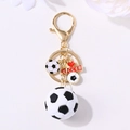 3D soccer keychain with gold metal clasp, red heart, and CCER tag on white background - Gold 3D Soccer Pendant Style