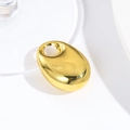 Macro shot of a polished gold teardrop pendant with a smooth reflective metallic surface - Gold Large Pebble (30*20MM)