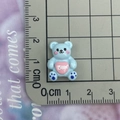 Detailed view of mini light blue resin bear accessory with pink heart and Bear engraving - Blue Heart Bear