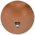 Golden heart necklace with black enamel evil eye pendant worn on a model - Black Heart Evil Eye Necklace