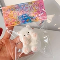 White bear squeeze toy in pinch family packaging for stress relief and fun - Spoiled Dog