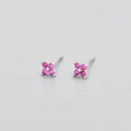 Silver flower stud earrings with four round rose red zircons on a gray background - Platinum Rose Red Zirconia