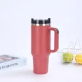 Detail of 40oz insulated tumbler with handle and straw in matte coral pink finish - Red (Generation 2)
