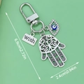 Blue Evil Eye Hamsa Hand metal keychain with silver wish charm and crystal detail - Evil Eye Hamsa Hand