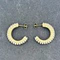 Detailed close-up of C-shaped 18k gold earrings with micro-set rhinestones on stone - C-Shape Full Rhinestone