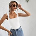 Detailed close-up of white ribbed tank top fabric with a classic square neckline - S / White