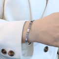 Elegante bracciale in argento con numeri romani e zirconi in acciaio placcato oro 18k - Color Acciaio
