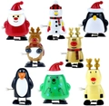 7-piece Christmas wind-up toy set featuring Santa, snowman, penguin, and reindeer figures - Christmas Wind Up 8pcs Set A