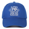 Detail of 70th birthday embroidery on blue cotton canvas baseball cap surface - Blue