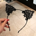 Handheld view of black lace cat ear headband featuring elegant floral patterns - Lace Cat Ear / Black