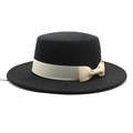 Detail of a black wool boater hat featuring a cream grosgrain ribbon and bow decoration - M (56-58cm) / Black