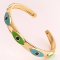 Detail of gold evil eye cuff bracelet with blue and green enamel and small gemstones - Sky Blue Green Enamel Style (SL99-4)