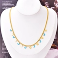 Golden star and blue drip oil moon necklace displayed on a white neck mannequin bust - Abstract Moon Necklace