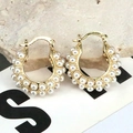 Detailed shot of gold-plated hoop earrings with double-row inlaid white pearls on a stone - Style 4/Wide Double-Row Pearl Huggie