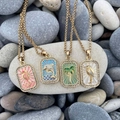 Gold tarot-style necklaces with ocean charms including seahorse and palm tree on pebbles - Palm Tree Necklace