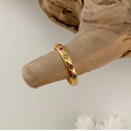 Detail of gold titanium ring with colorful crystals on a natural wood branch - US 6 / Wide Style