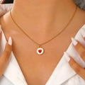 Close-up of a sweet strawberry enamel pendant on a fine gold-plated stainless steel chain - Round Strawberry Style (DZ-638)