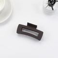 Matte dark brown rectangular cutout claw clip for thick hair styling - Charcoal Black