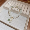 Macro shot of light green and white bead bracelet in a wooden jewelry box with gold charms - 7# Natural Stone Lotus Pendant Beaded Bracelet
