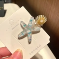 Detail of starfish and shell hair clips with glitter and pearls on display card - 8* Beach Starfish - White