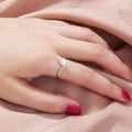 Elegant silver ring with white pearl and diamonds worn on finger over pink silk - Artificial Pearl Style (SE894)