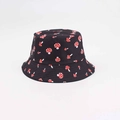 Close-up of black reversible bucket hat with red and white polka dot mushroom print - Black Mushroom