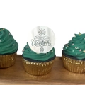 Close-up of Merry Christmas acrylic cupcake topper on festive green frosted cake - Silver Bell Style / Silver