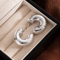 Polished silver C-shaped chunky hoop earrings placed on soft velvet in a gift box - Silver Cylindrical C-Shape