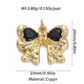 Golden French bow pendant with black heart gemstones in copper material - Gold Bow with Black Heart Gemstone Pendant