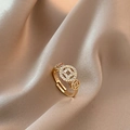 Close-up of golden coin ring with zircon inlay and adjustable band on silk cloth - Style F-Chinese Style Coin Zircon